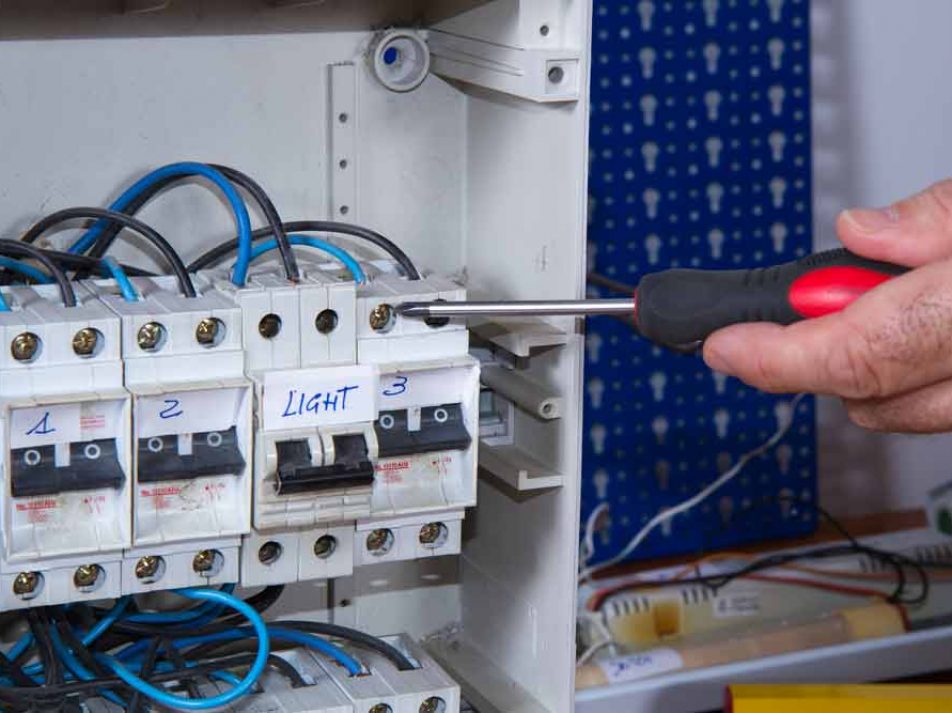 Close Up Image Of Electrician Working In A Fuse Box — Coughran Electrical Electrician services in Northern Rivers Byron, NSW