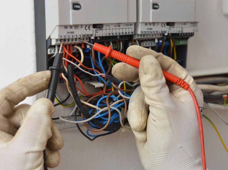 Electrician Doing Wire Repair Using Multimeter — Coughran Electrical Electrician services in Northern Rivers Byron, NSW