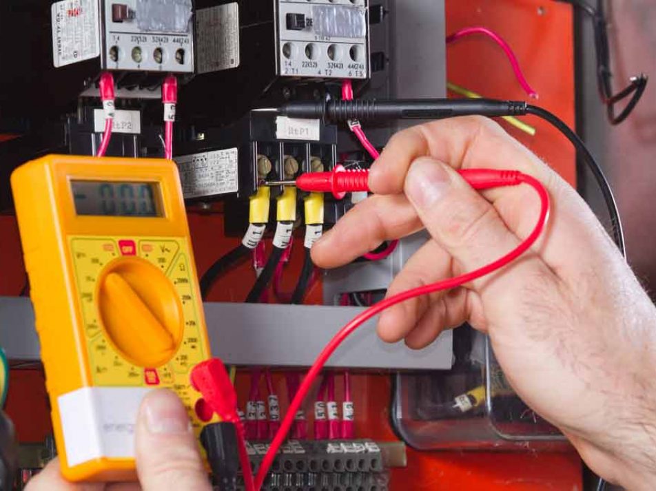 Electrician Testing The Voltage Using Multimeter — Coughran Electrical Electrician services in Northern Rivers Byron, NSW