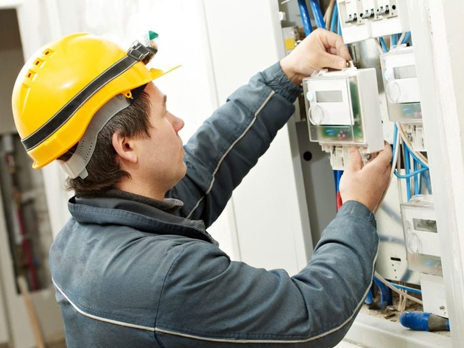 Electrician Installing Energy Saving Meter — Coughran Electrical Electrician services in Northern Rivers Byron, NSW